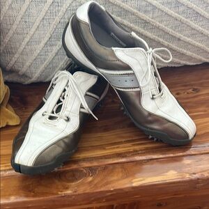 Womens golf shoes with plastic spikes.